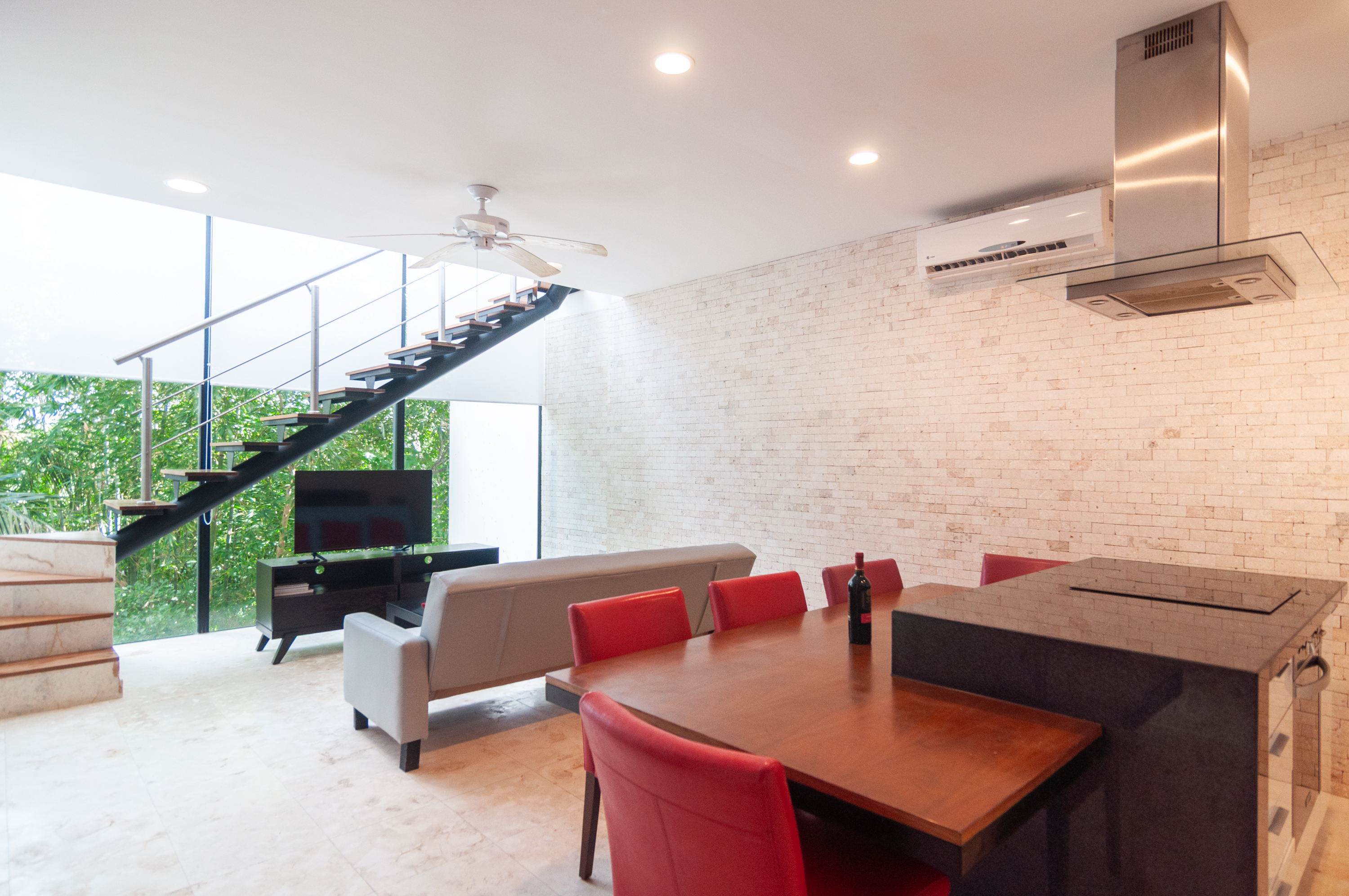 ANAH Tulum 320 open living and dining area with treetop views