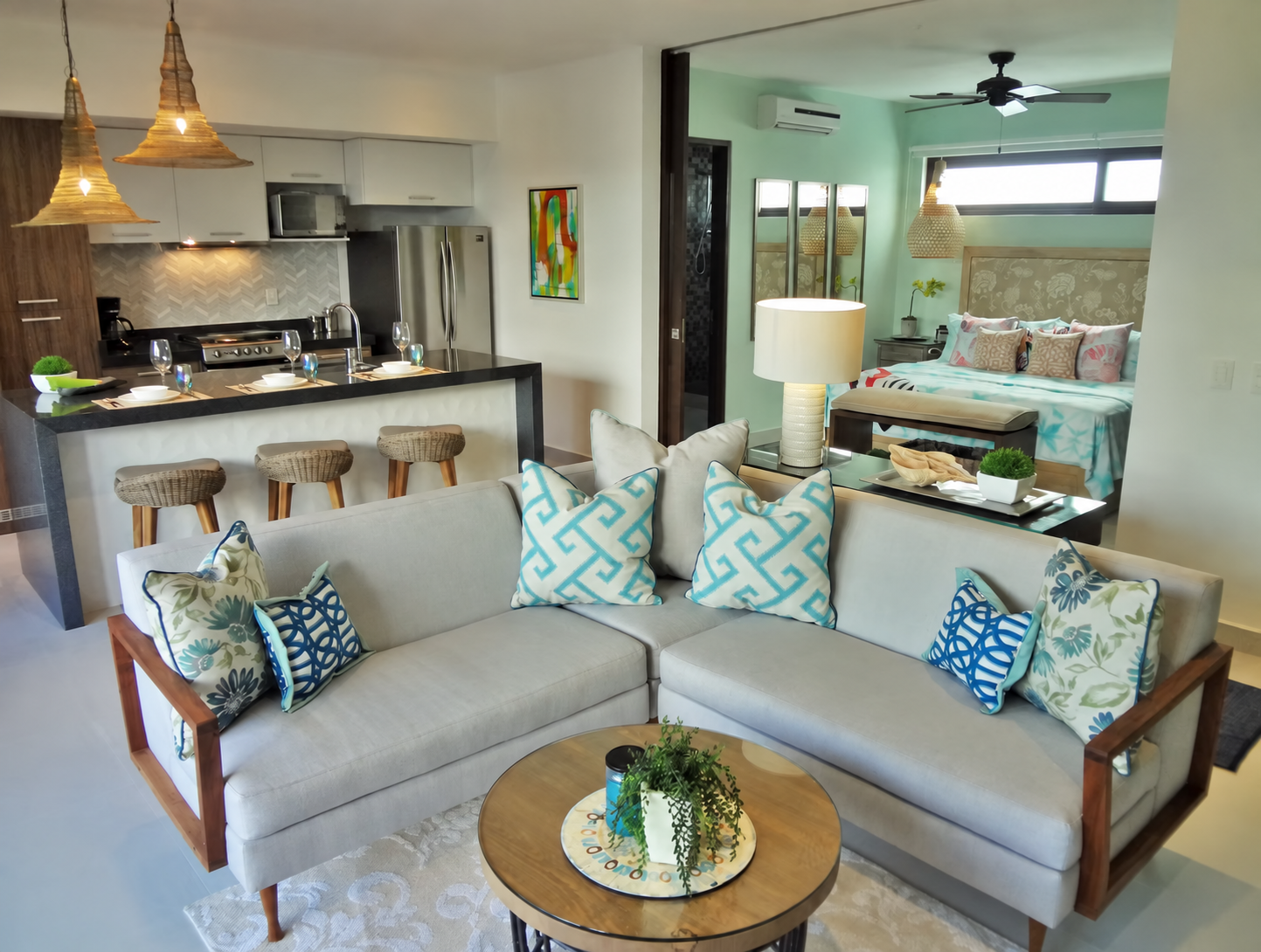 TAO Hai M6 living room with the kitchen and bedroom beyond